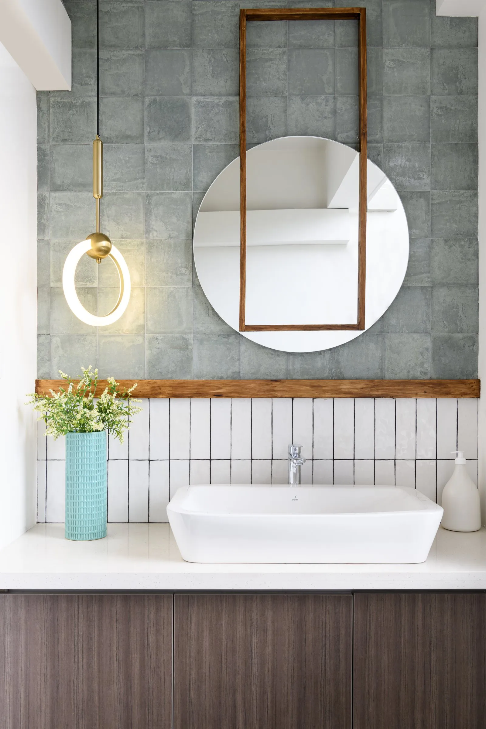 Bathroom basin with green tiles
