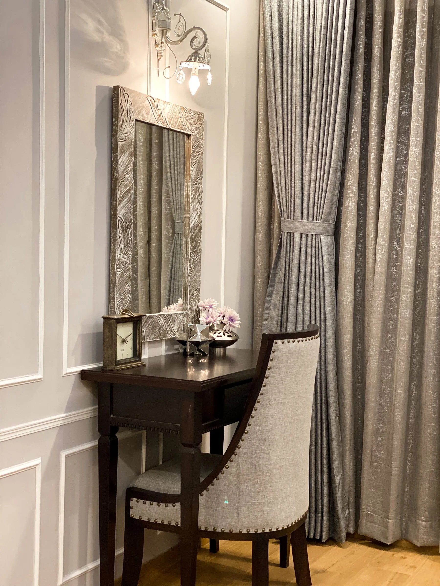 Writing desk with a mirror and silver curtains