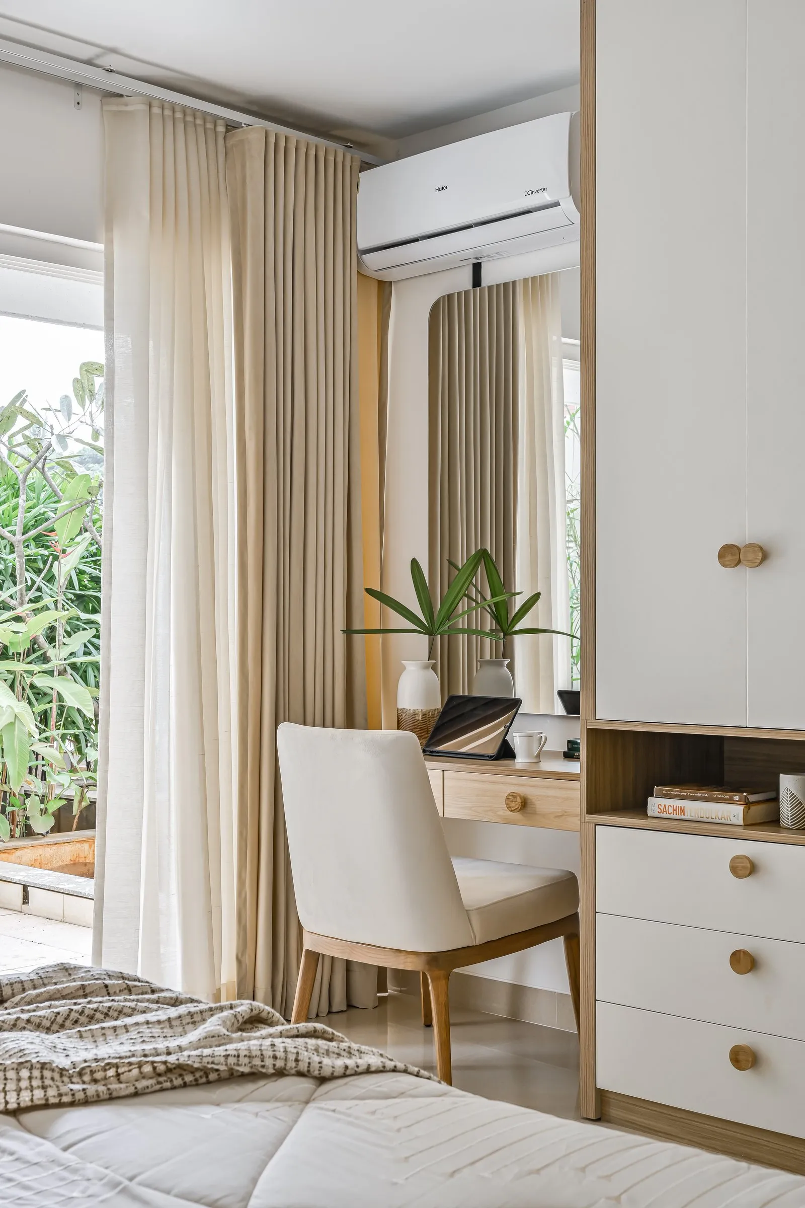 Study desk by the window with a cream chair