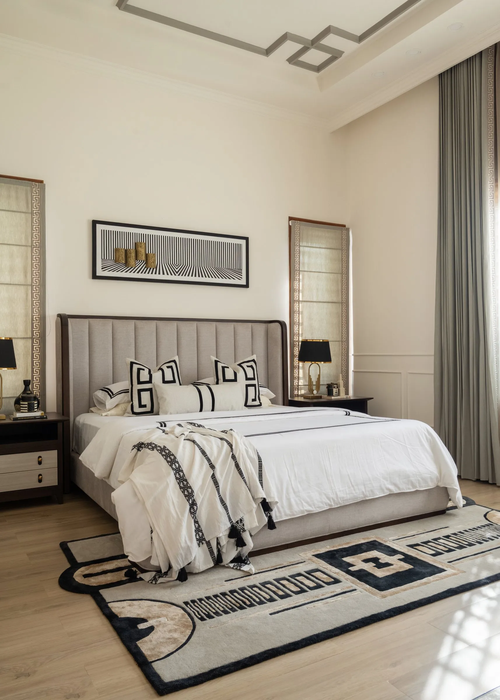 Bedroom with a graphic black and cream rug