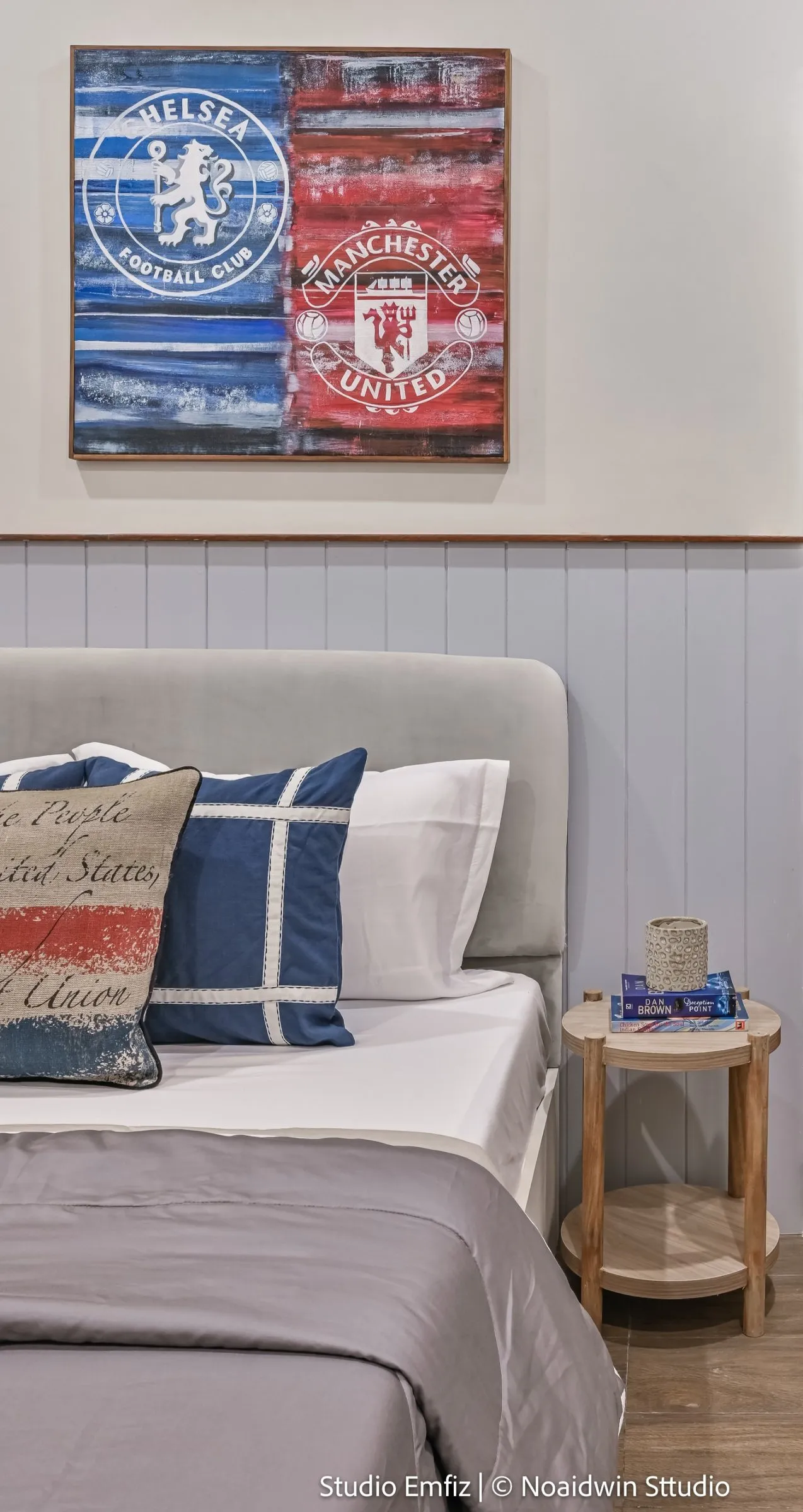 Bedroom with blue panelling and football club artwork