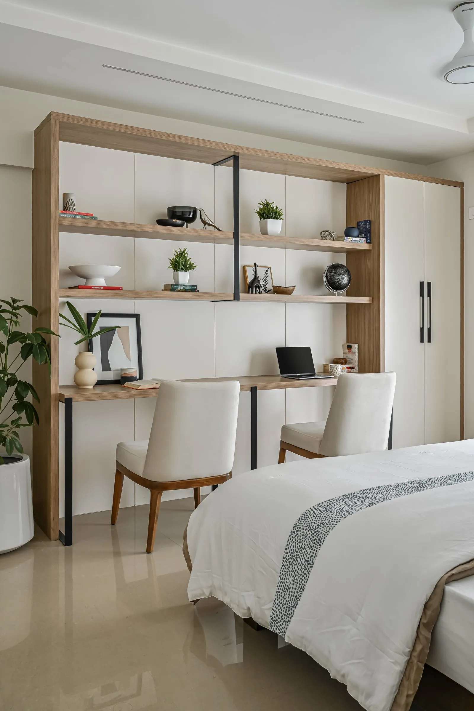 Bedroom with an oak shelving unit and a study desk