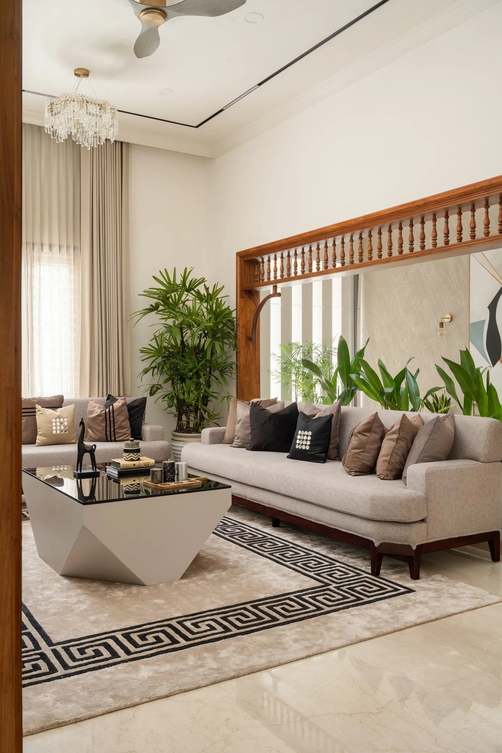 Anvaya living room framed by a carved wooden lattice