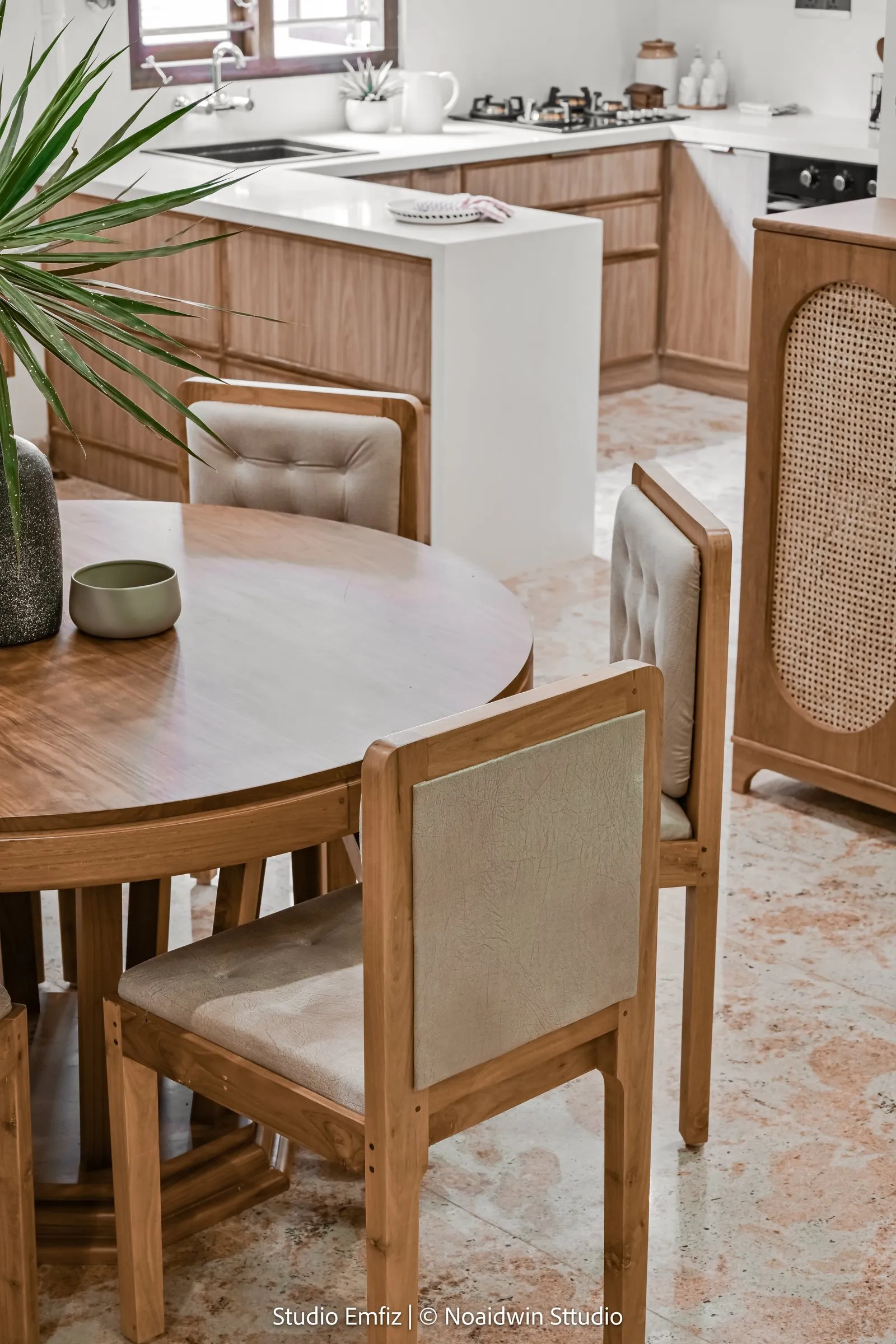 Oak dining chairs around a round table
