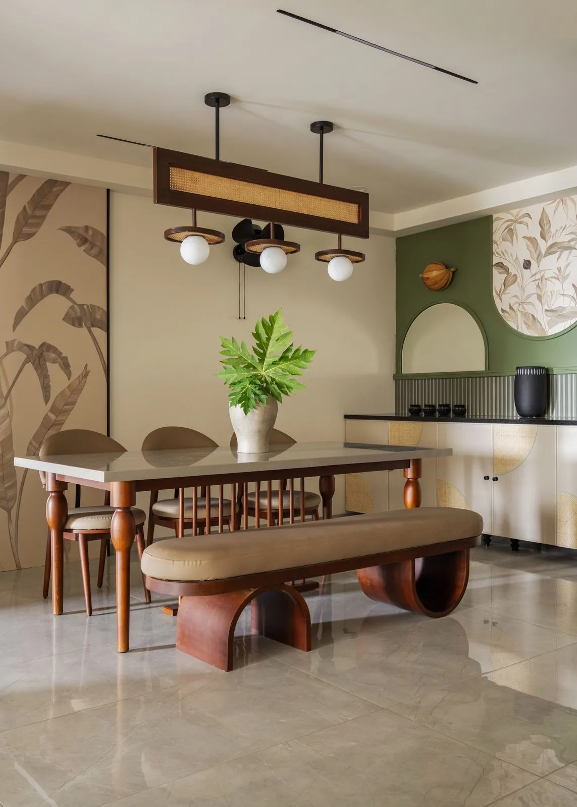 Hyrat dining room with sculpted bench and sage wall