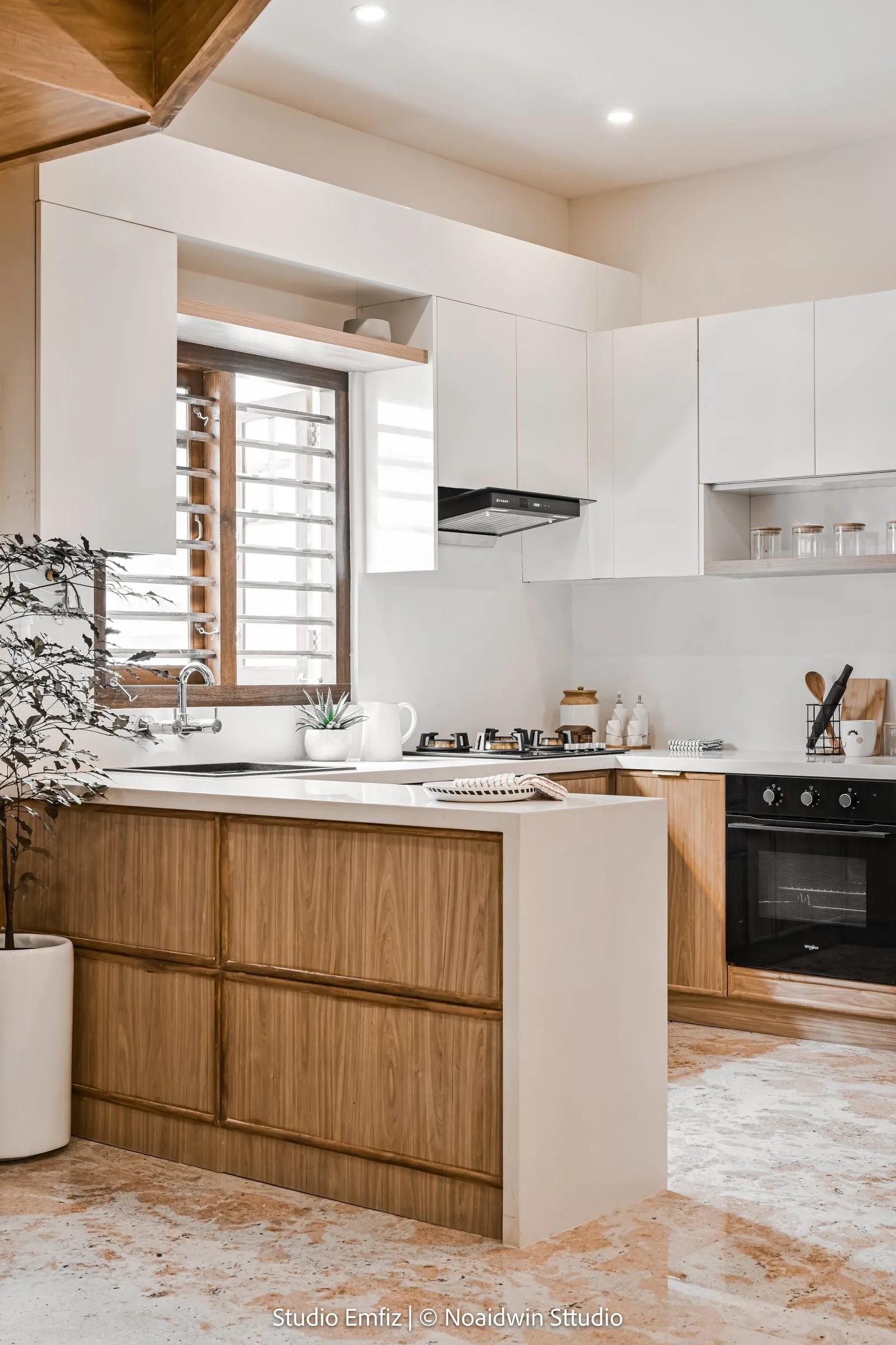 Kitchen with oak lower cabinets and white upper cabinets