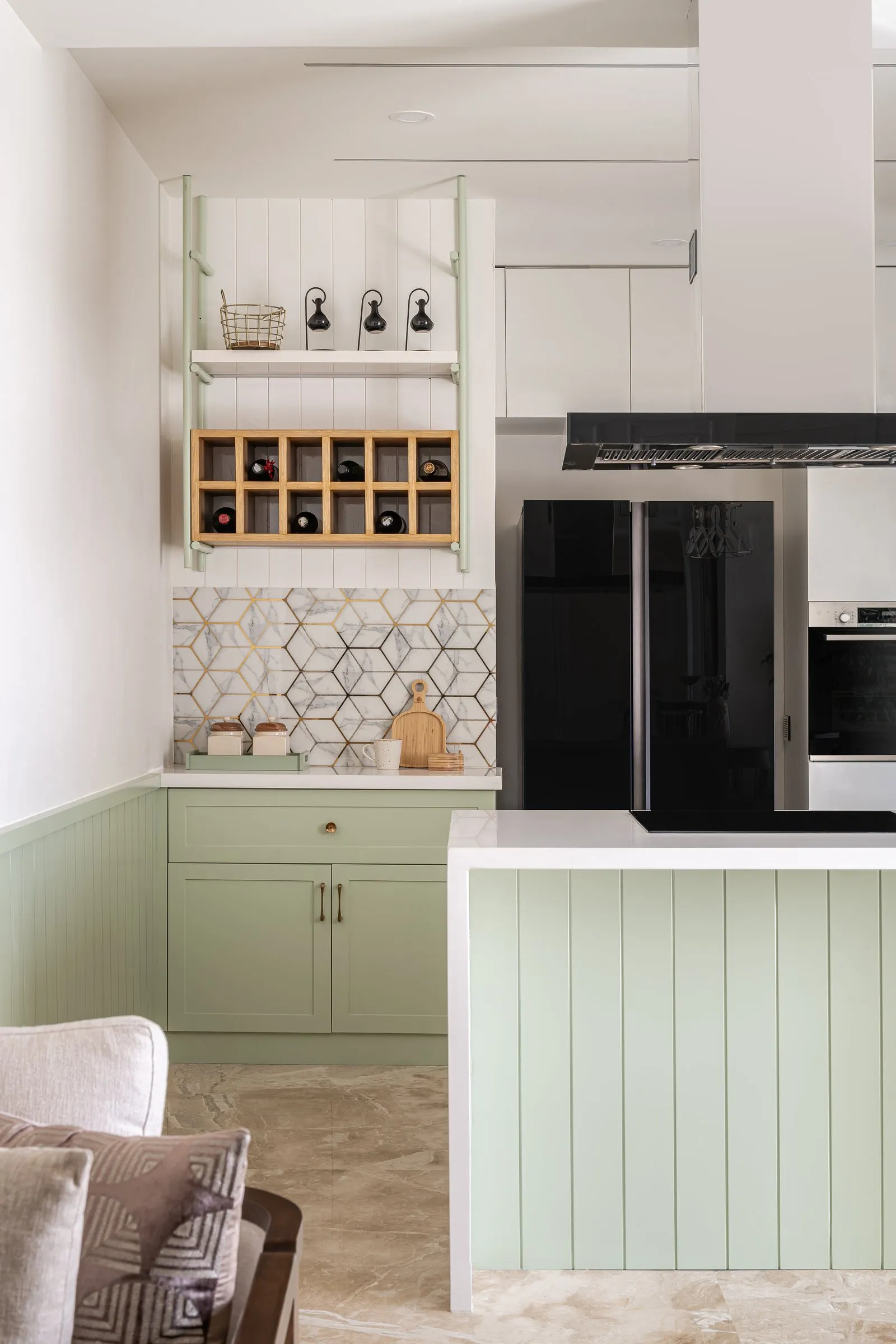 Kitchen with open wine shelves and a black fridge