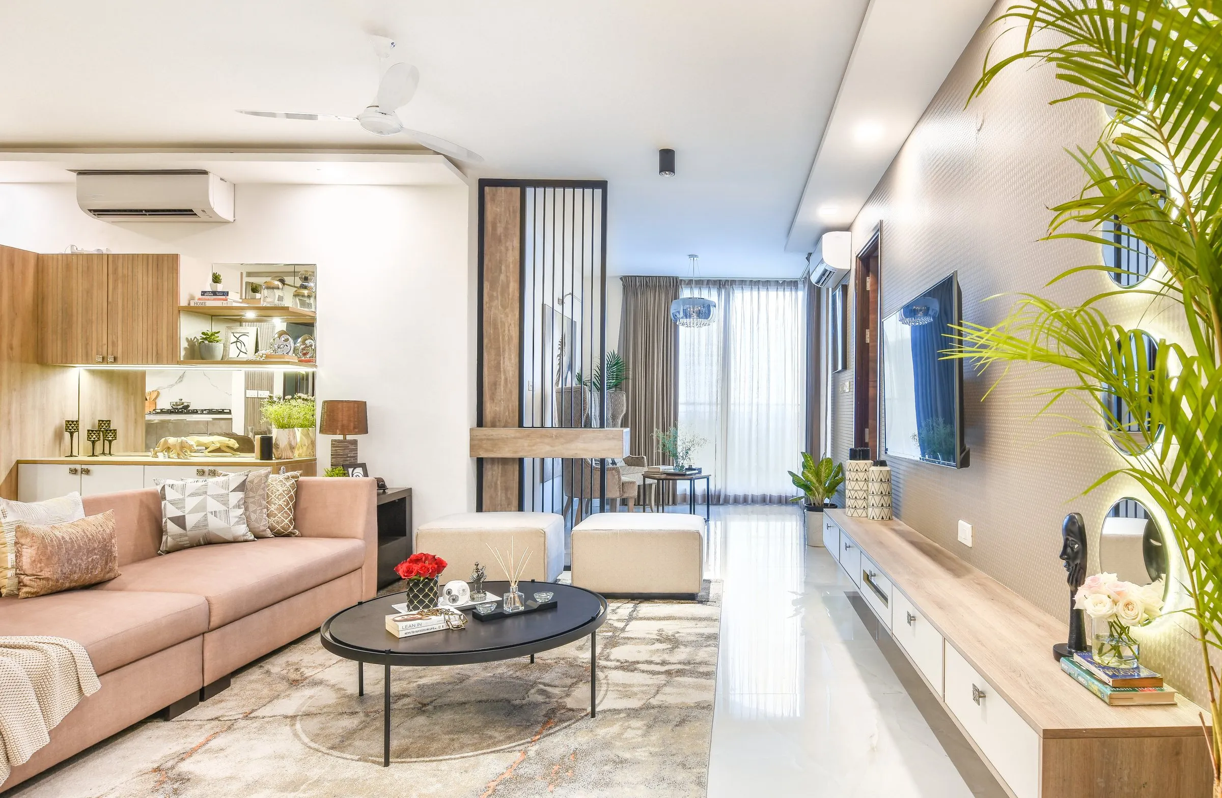 Open living room with blush sofas and a round coffee table
