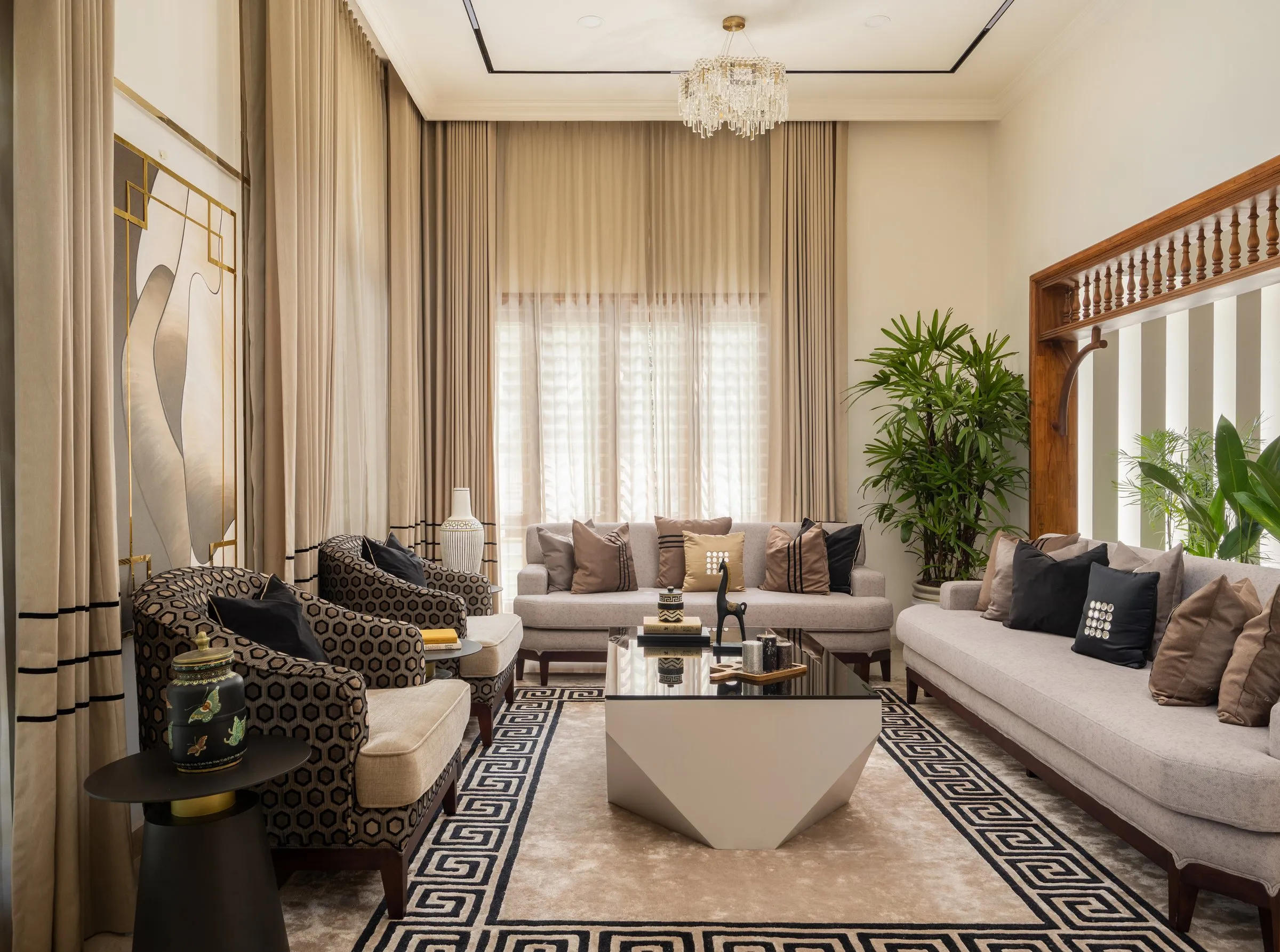 Living room with a Greek-key rug and a teak lattice