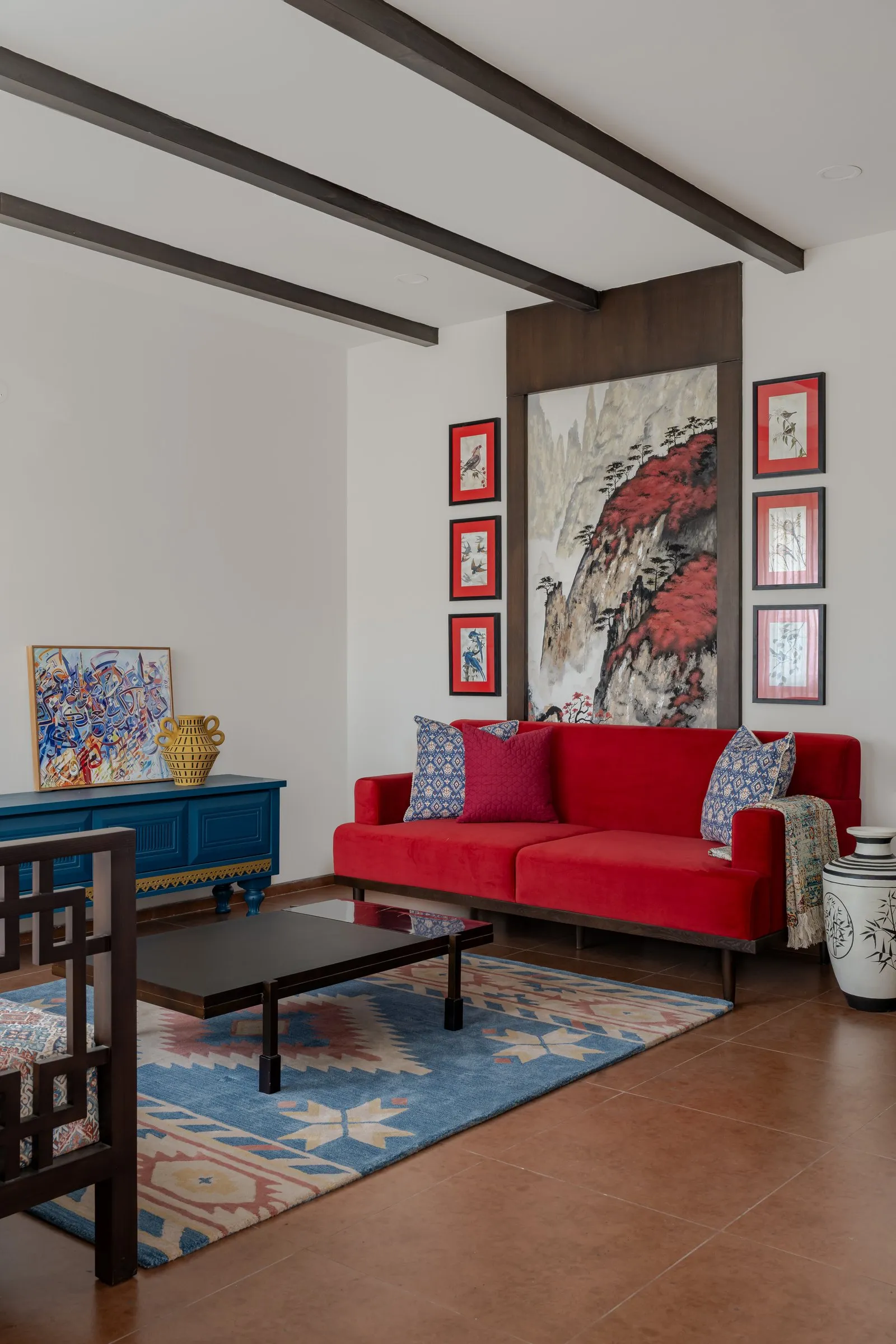 Living room with a red sofa