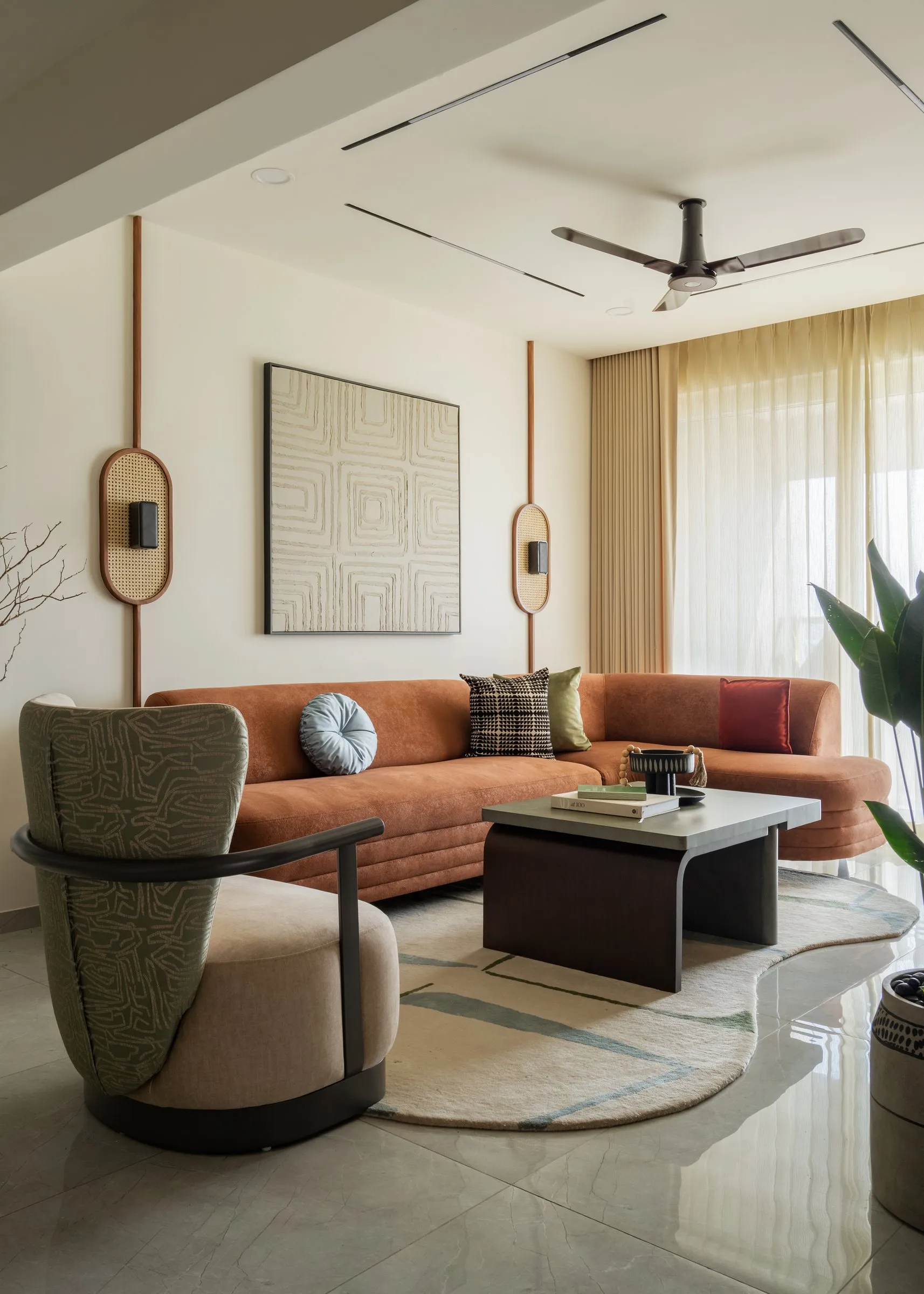 Living room with a sculpted armchair and round rug