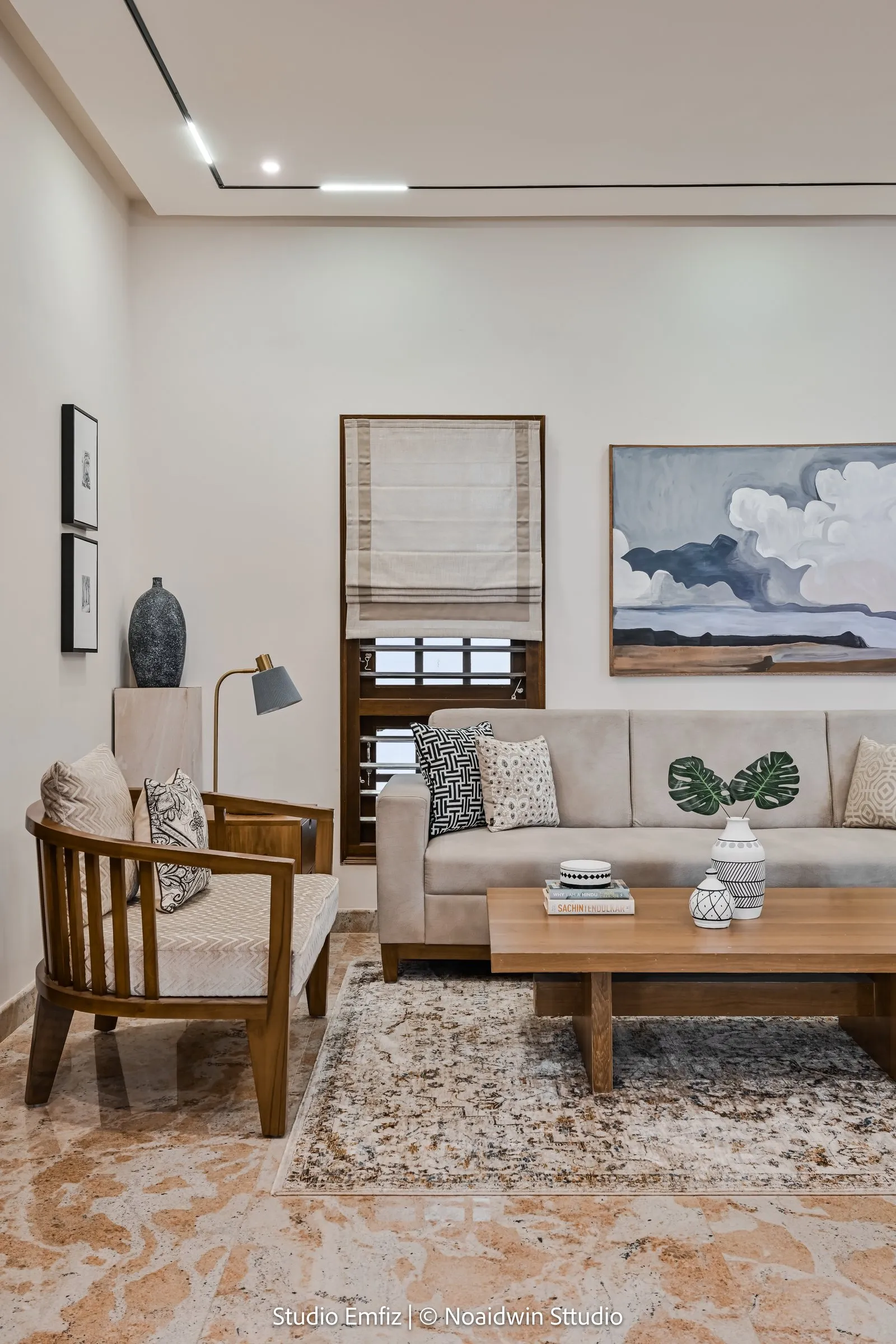 Teak armchair and sofa with blue and white cushions