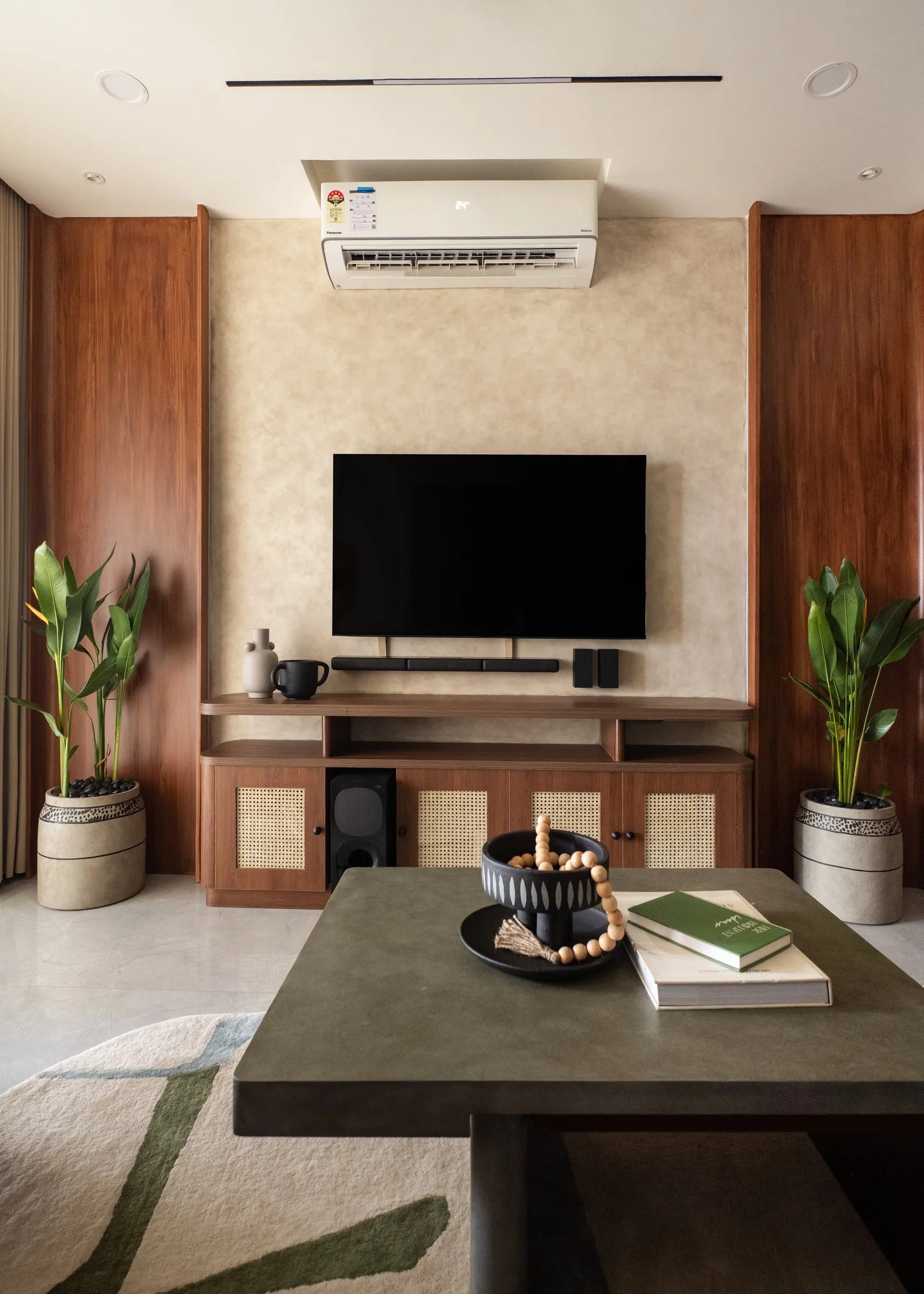 TV wall in walnut with a stone coffee table