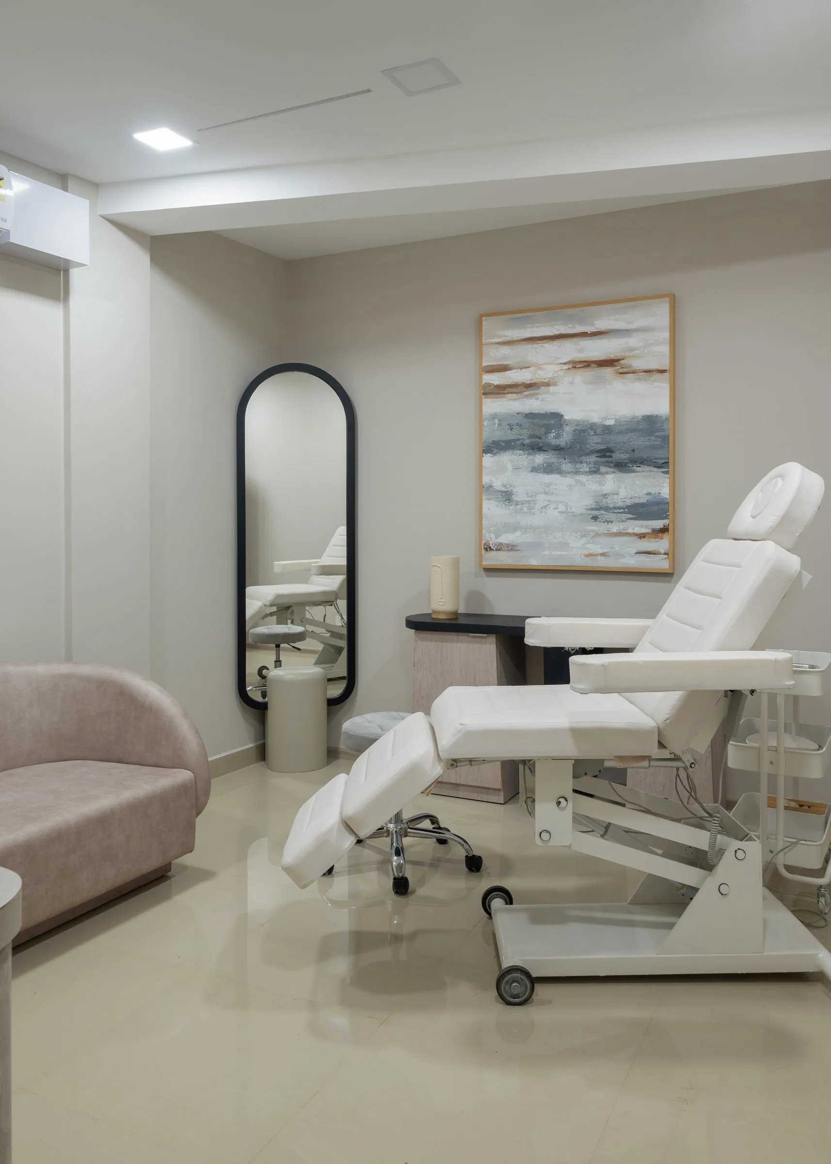 Treatment room with a white chair